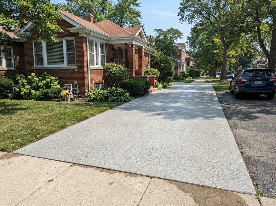 Pressure Washing: Clean Concrete Driveway After Power Washing Service