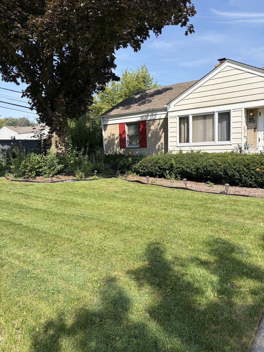 Striped lawn and trimmed beds